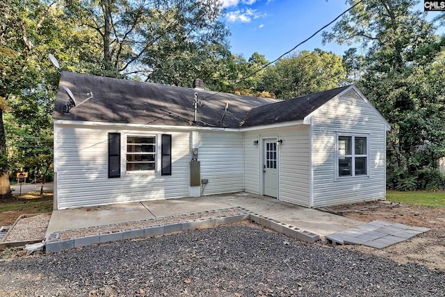 rear view of property featuring a patio