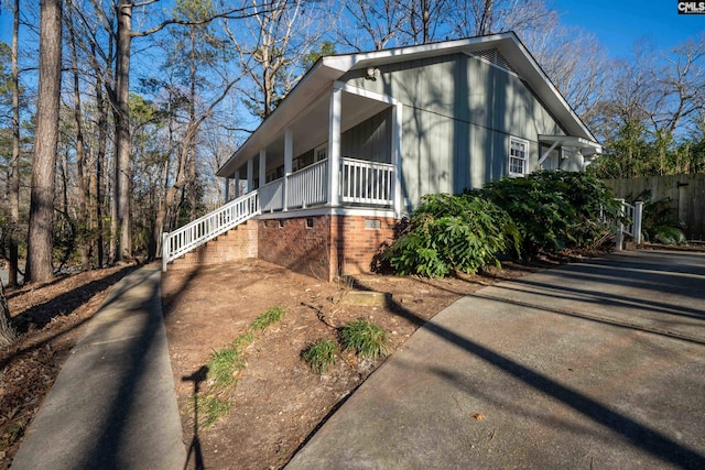 view of property exterior featuring covered porch