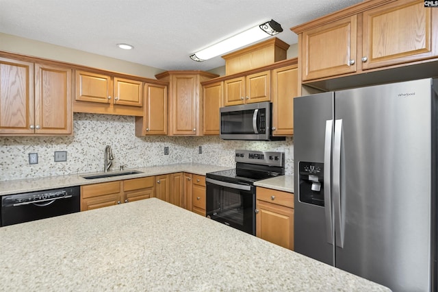 kitchen with sink, backsplash, and stainless steel appliances