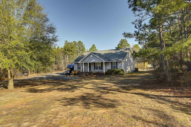 view of front of house with a front lawn and a porch