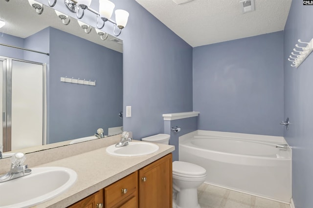 full bathroom featuring a textured ceiling, toilet, vanity, and independent shower and bath