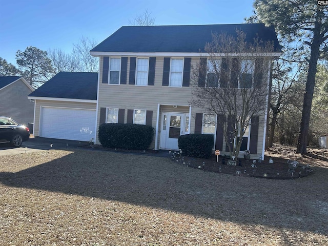 colonial home with a garage