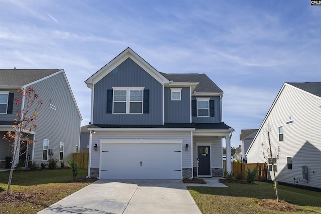 view of front of house with a garage and a front yard