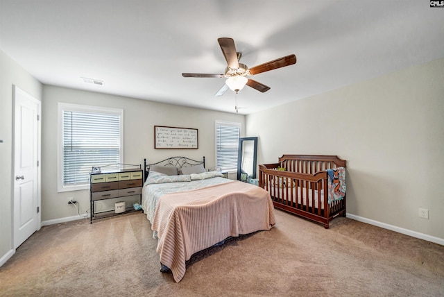 carpeted bedroom with ceiling fan