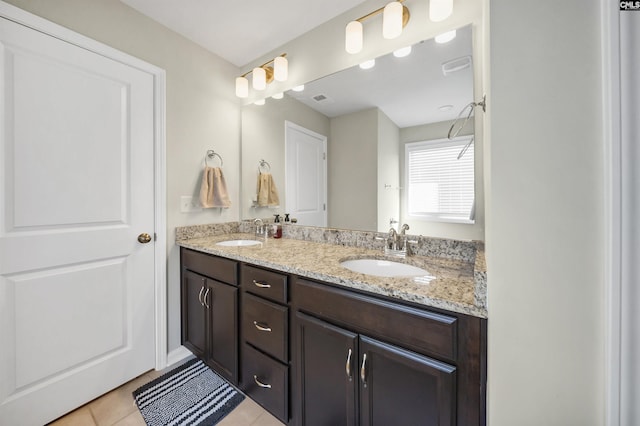 bathroom with vanity and tile patterned flooring