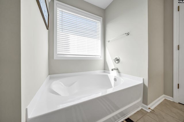 bathroom featuring a bathing tub and tile patterned flooring