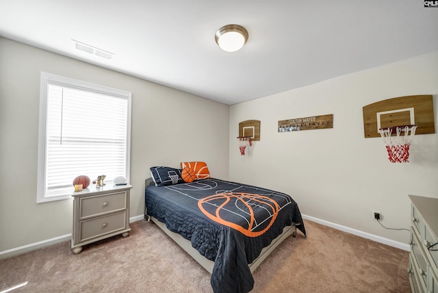 bedroom featuring light carpet