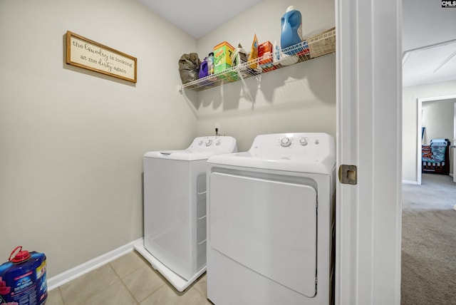 laundry room featuring light carpet and independent washer and dryer