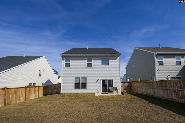 rear view of house featuring a patio area and a lawn