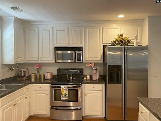 kitchen featuring white cabinets and stainless steel appliances