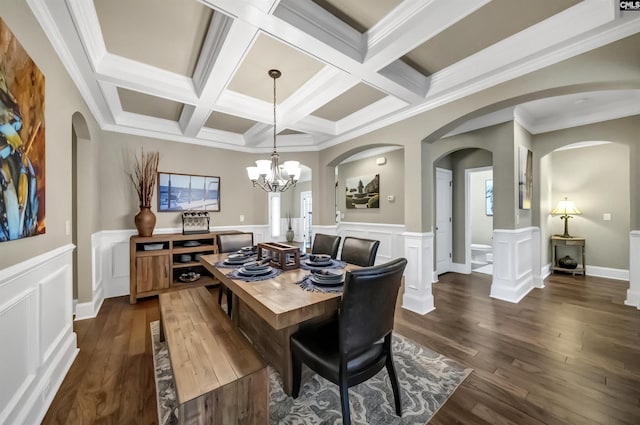 dining area featuring a chandelier, ornamental molding, beamed ceiling, and coffered ceiling