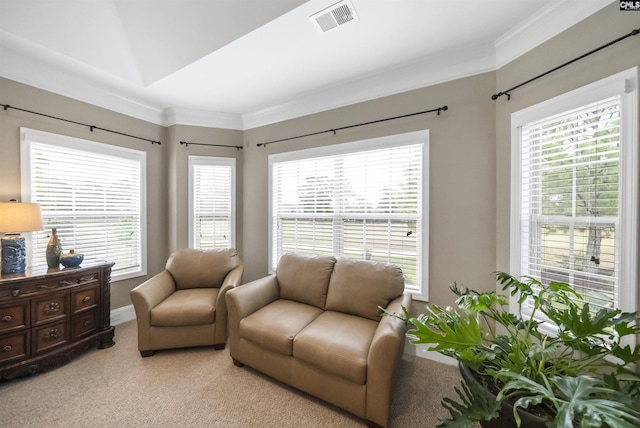 sitting room with crown molding, a healthy amount of sunlight, and light colored carpet