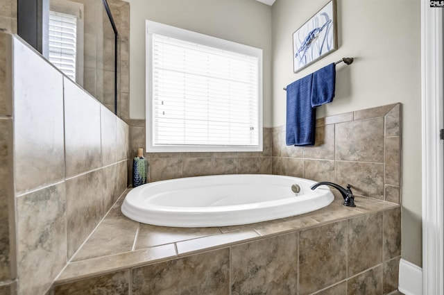 bathroom featuring tiled bath