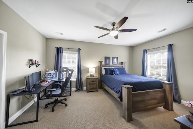 carpeted bedroom with ceiling fan