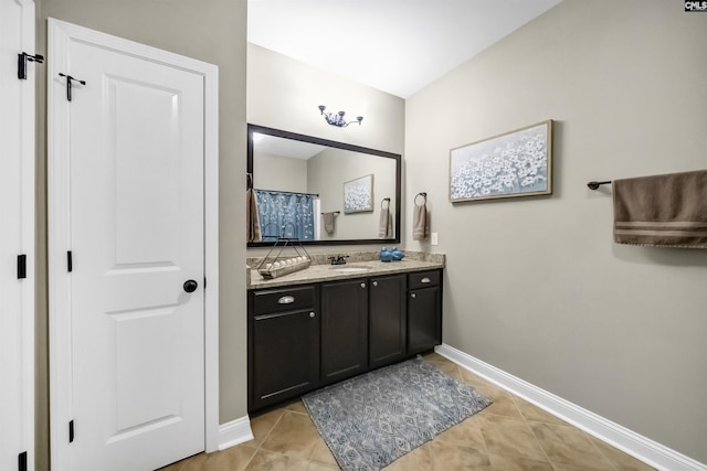 bathroom with tile patterned floors and vanity