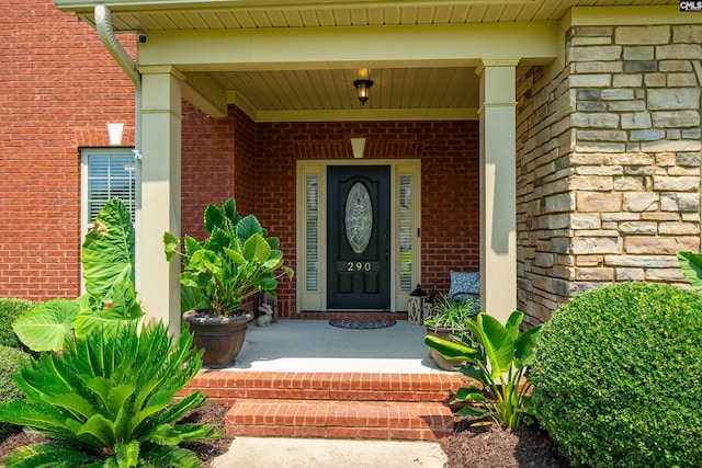 doorway to property with a porch