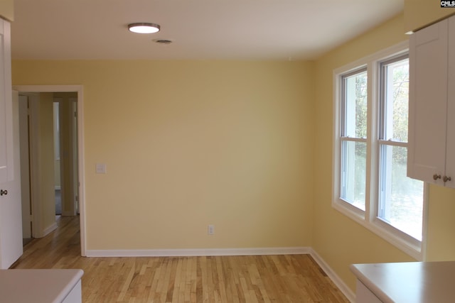 unfurnished room with light hardwood / wood-style flooring