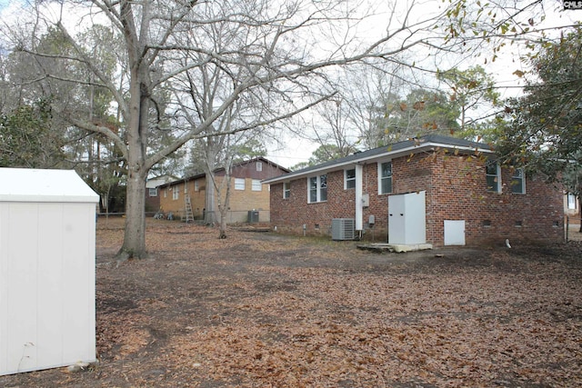 view of yard featuring central air condition unit