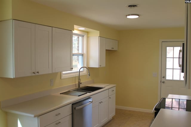 kitchen featuring sink, white cabinetry, and stainless steel dishwasher