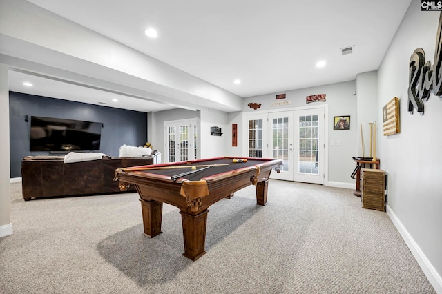 recreation room with pool table, light carpet, and french doors