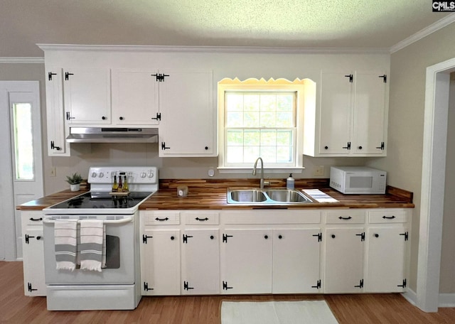 kitchen with white cabinets, sink, and white appliances