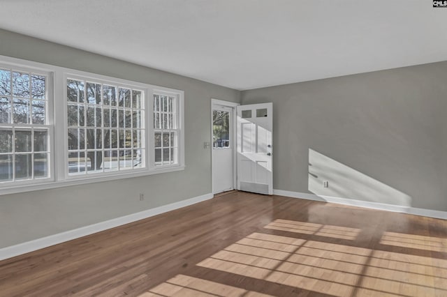 unfurnished room featuring wood-type flooring