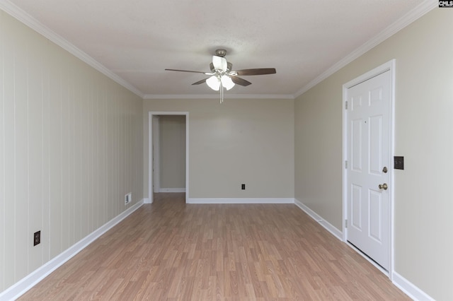 unfurnished room with ceiling fan, light hardwood / wood-style flooring, and ornamental molding