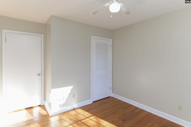 unfurnished bedroom with ceiling fan and light hardwood / wood-style flooring