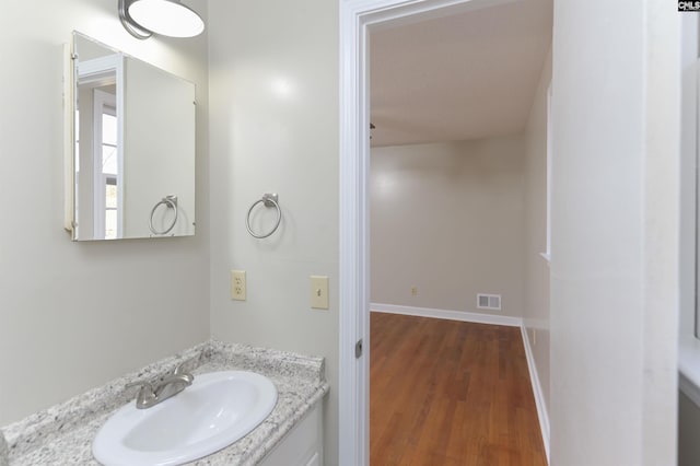 bathroom featuring vanity and hardwood / wood-style floors