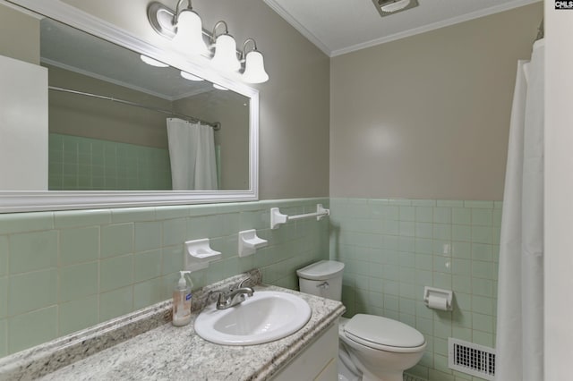 bathroom featuring toilet, ornamental molding, tile walls, and vanity