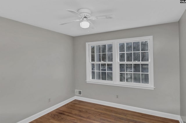 empty room with ceiling fan and wood-type flooring