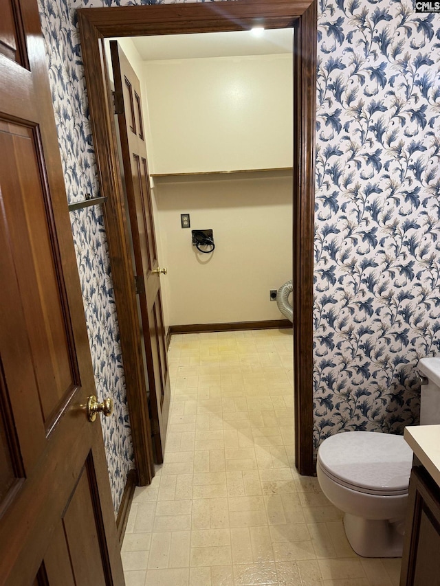 bathroom featuring toilet and vanity