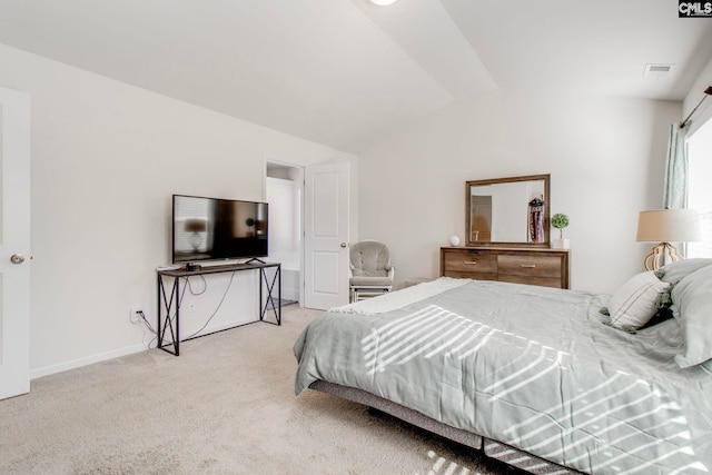 carpeted bedroom featuring lofted ceiling