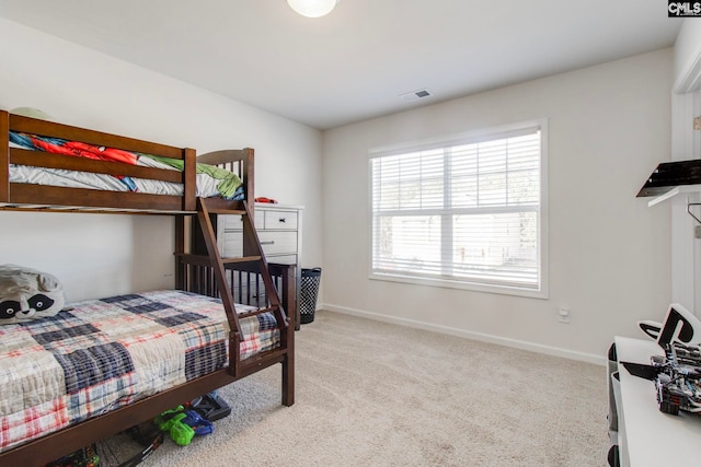 bedroom featuring light colored carpet