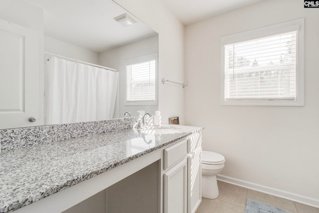 bathroom with toilet and vanity