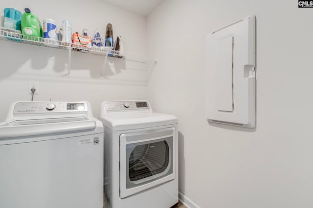 clothes washing area featuring washer and clothes dryer