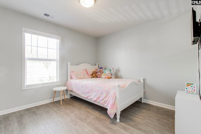 bedroom featuring wood-type flooring