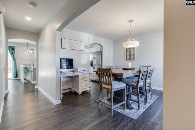 dining room with dark hardwood / wood-style floors