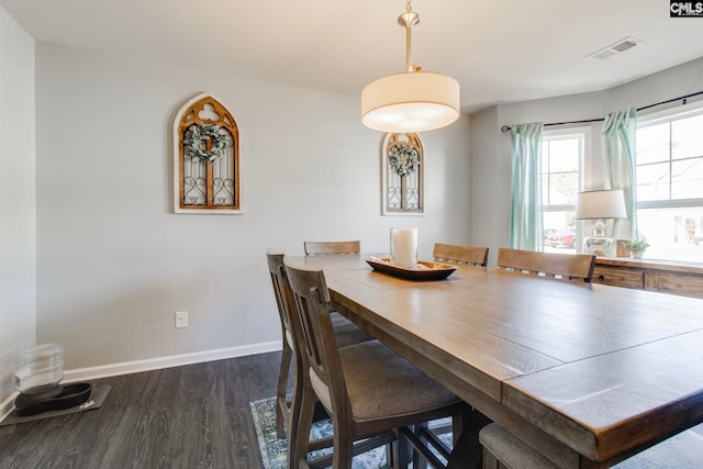 dining space featuring dark hardwood / wood-style flooring