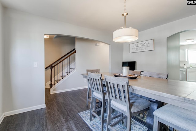 dining area featuring dark hardwood / wood-style flooring