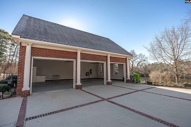 back of property with a garage