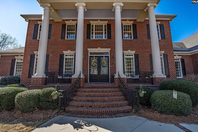 greek revival inspired property with french doors