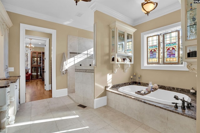 bathroom with ornamental molding, shower with separate bathtub, tile patterned floors, and a notable chandelier