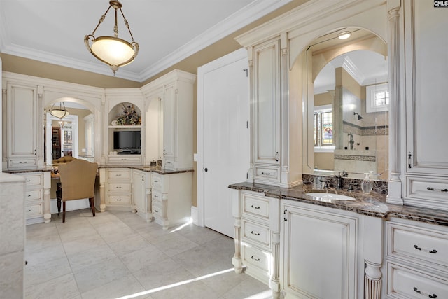 bathroom featuring vanity, ornamental molding, tile patterned floors, and walk in shower