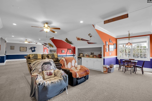 living room featuring ceiling fan, light colored carpet, vaulted ceiling, and crown molding