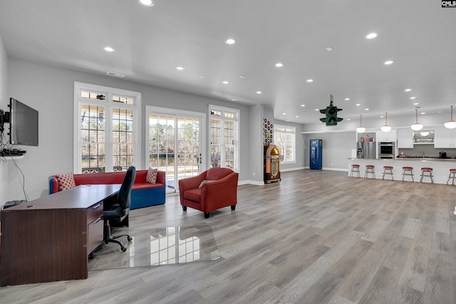 office with light hardwood / wood-style floors