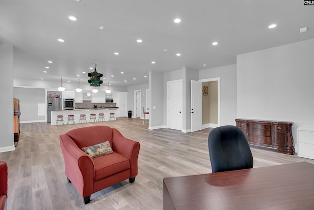 living room with light hardwood / wood-style floors