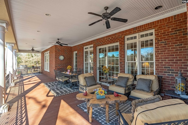 view of patio with ceiling fan and an outdoor living space