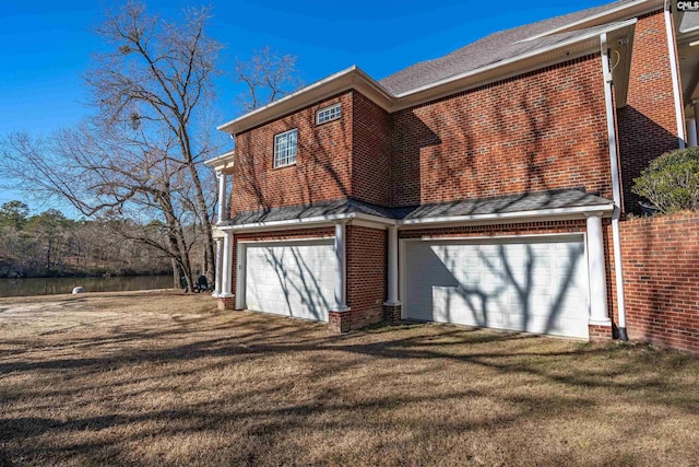 garage featuring a yard