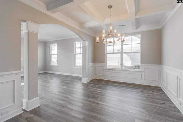 unfurnished dining area with visible vents, arched walkways, coffered ceiling, dark wood-style floors, and beam ceiling